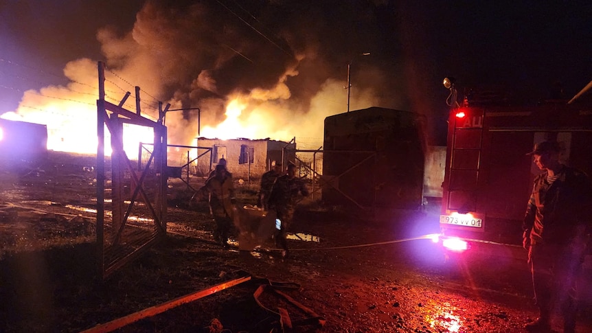 an explosion behind a truck. 