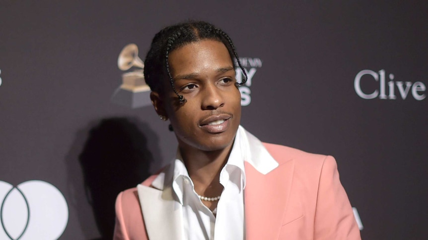 A$AP Rocky is seen wearing a pink suit at Pre-Grammy Gal.