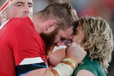 A Welsh player scuffles with a South African opponent at the Rugby World Cup.