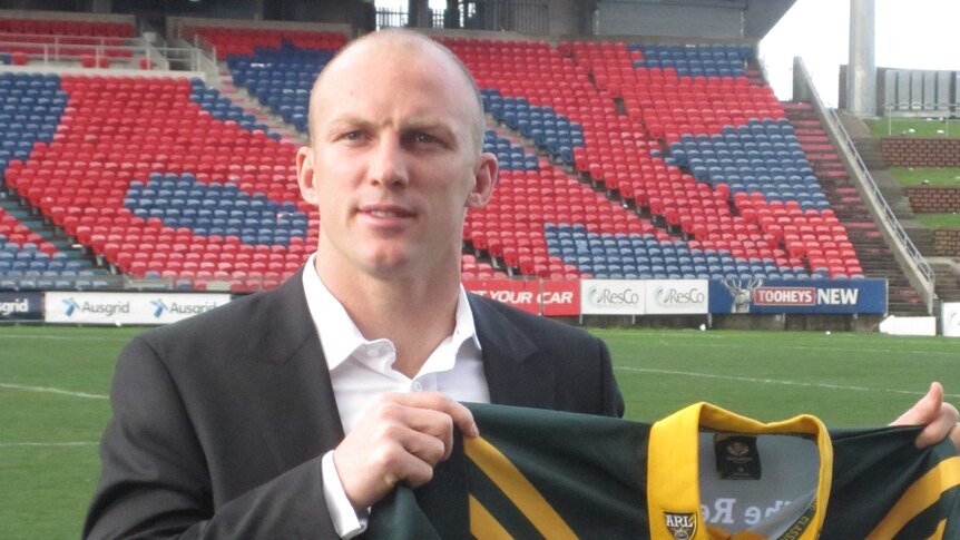 Kangaroos captain Darren Lockyer holding an Australian jersey at Ausgrid Stadium Newcastle