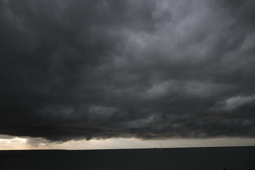 dark clouds over an ocean