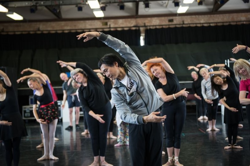 Li Cunxin leads a seniors ballet class at Queensland Ballet.