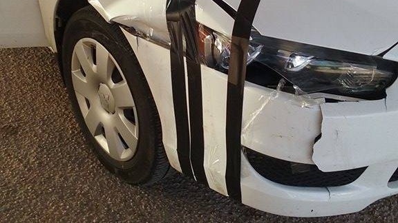 Car damaged by a kangaroo while driving along the Nullarbor Plain