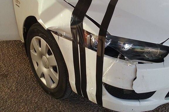 Car damaged by a kangaroo while driving along the Nullarbor Plain