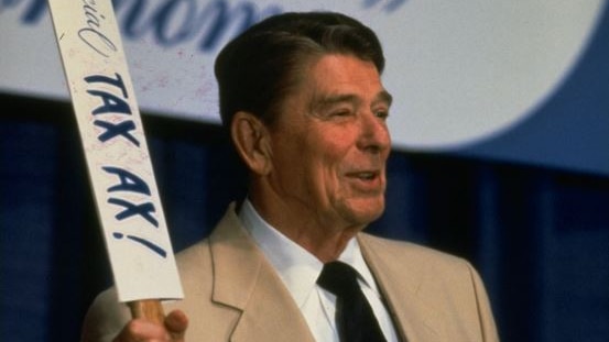 Image of President Ronald Reagan from the early 1980's  holding an axe with the words The Official TAX AX written around it.