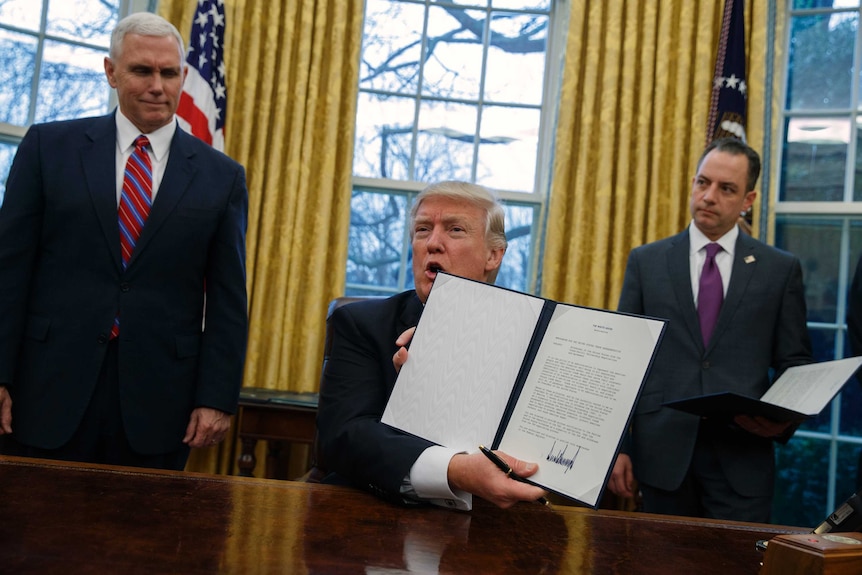 Donald Trump signs withdrawal from TPP