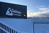 a building with Selwyn Snow Resort written on it and it's covered in snow
