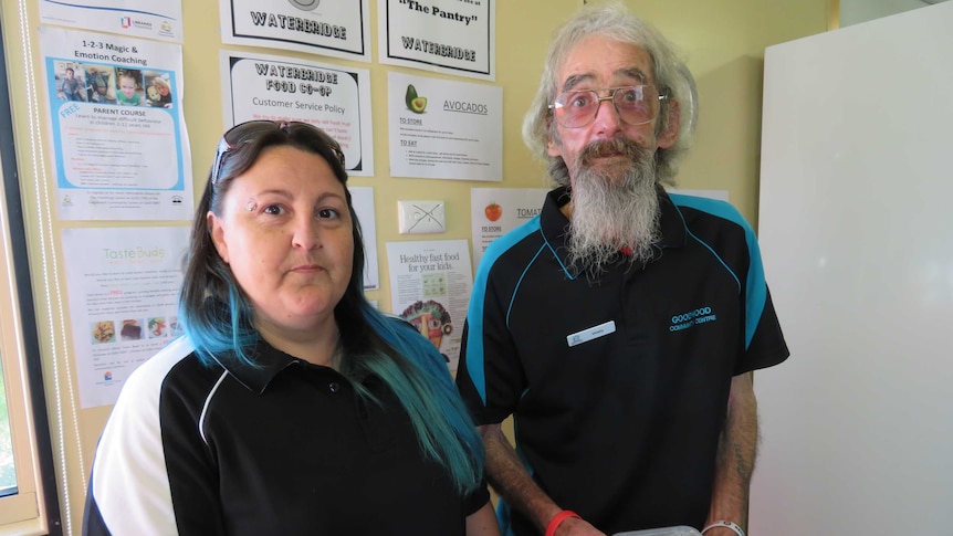 Two volunteers hand out ready-made meals at the Waterbridge Food Co-Op in Gagebrook, Tasmania, March 2019