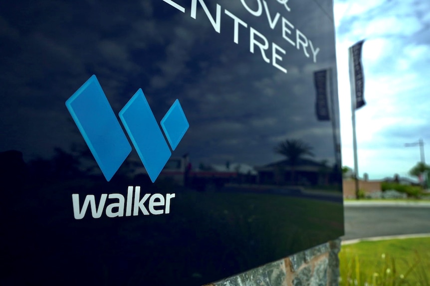 A Walker Corporation sign.