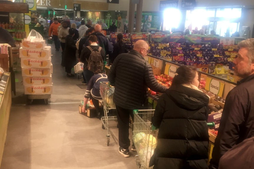 Shoppers lined up at Woolworths in Sandy Bay.