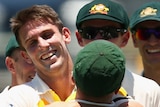 Australia's Mitchell Marsh celebrates the wicket of India's Shikhar Dhawan on day one at the Gabba.