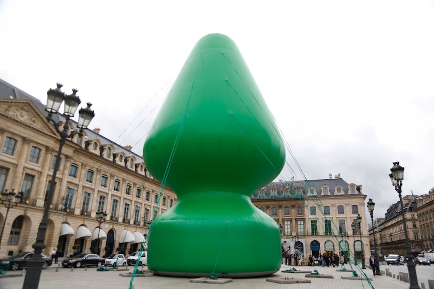 Sex toy shaped Christmas tree sits 25-metres high in Place Vendome