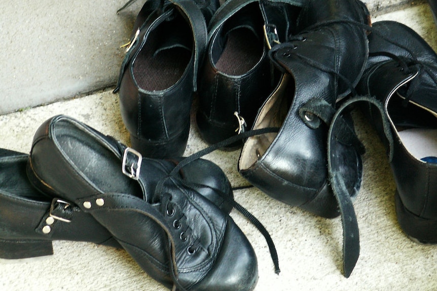 Dancing shoes with laces and buckles.