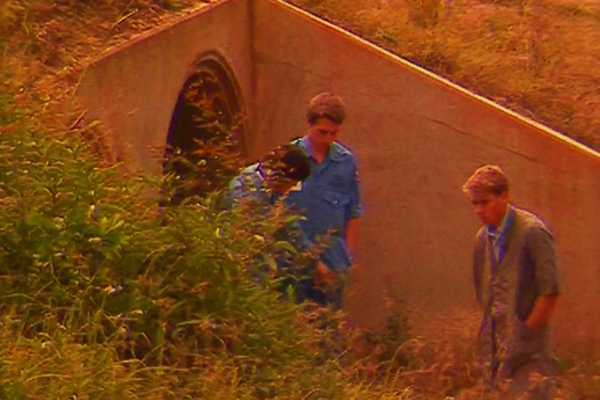 Forensic detectives at crime scene where the body of Janet Phillips was found in a drain.