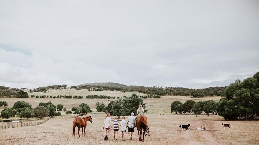 Family strolls on a rural property near Armidale, NSW.