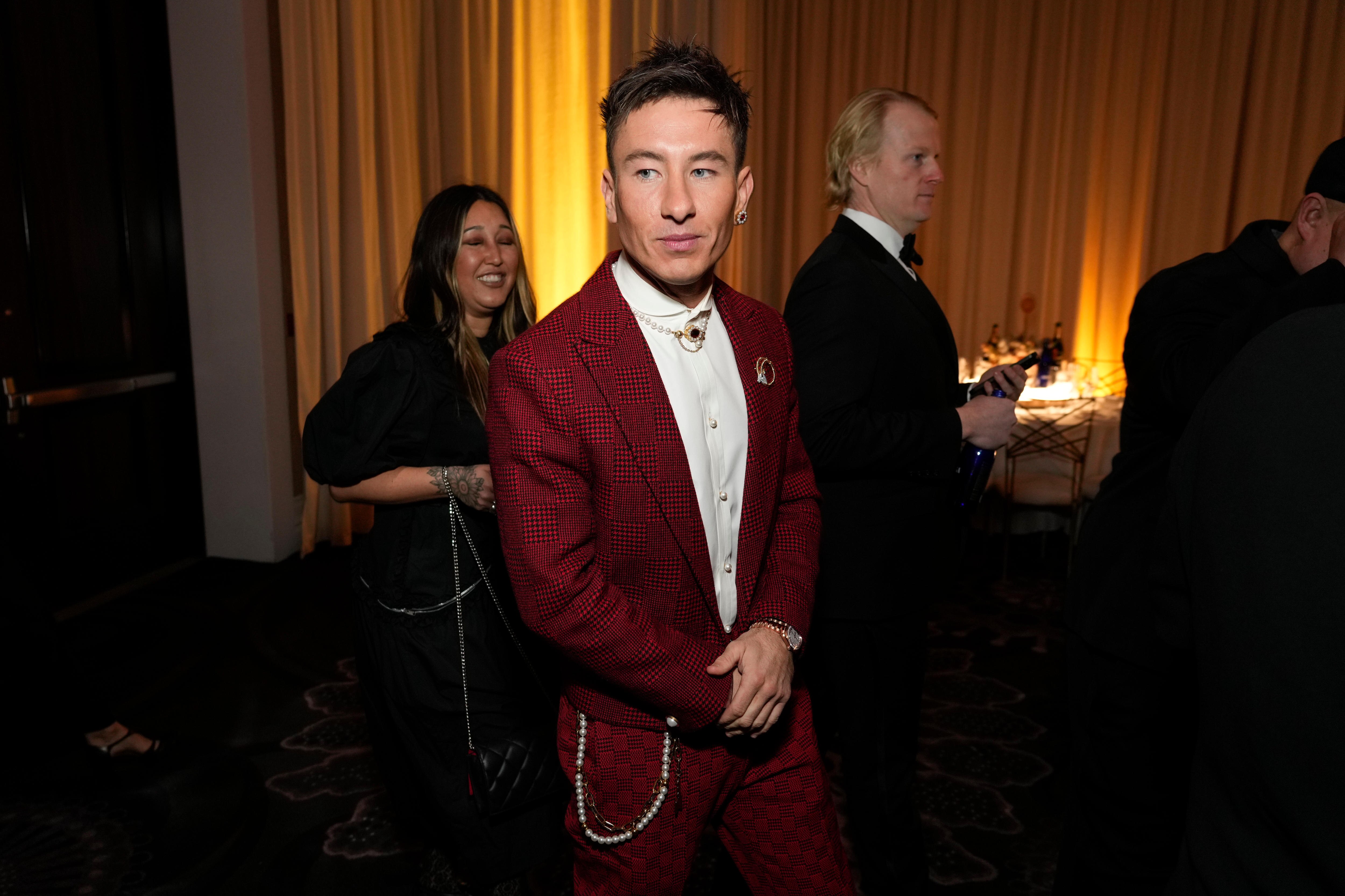 Actor Barry Keoghan at the Golden Globes wearing a red checkered suit