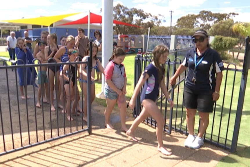 Children lining up at the waterslide