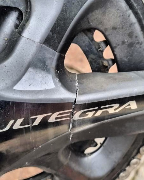 A broken crankset on a Shimano bike.