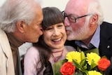 LtoR Keith Potger and Athol Guy give Judith Durham a 70th birthday kiss.