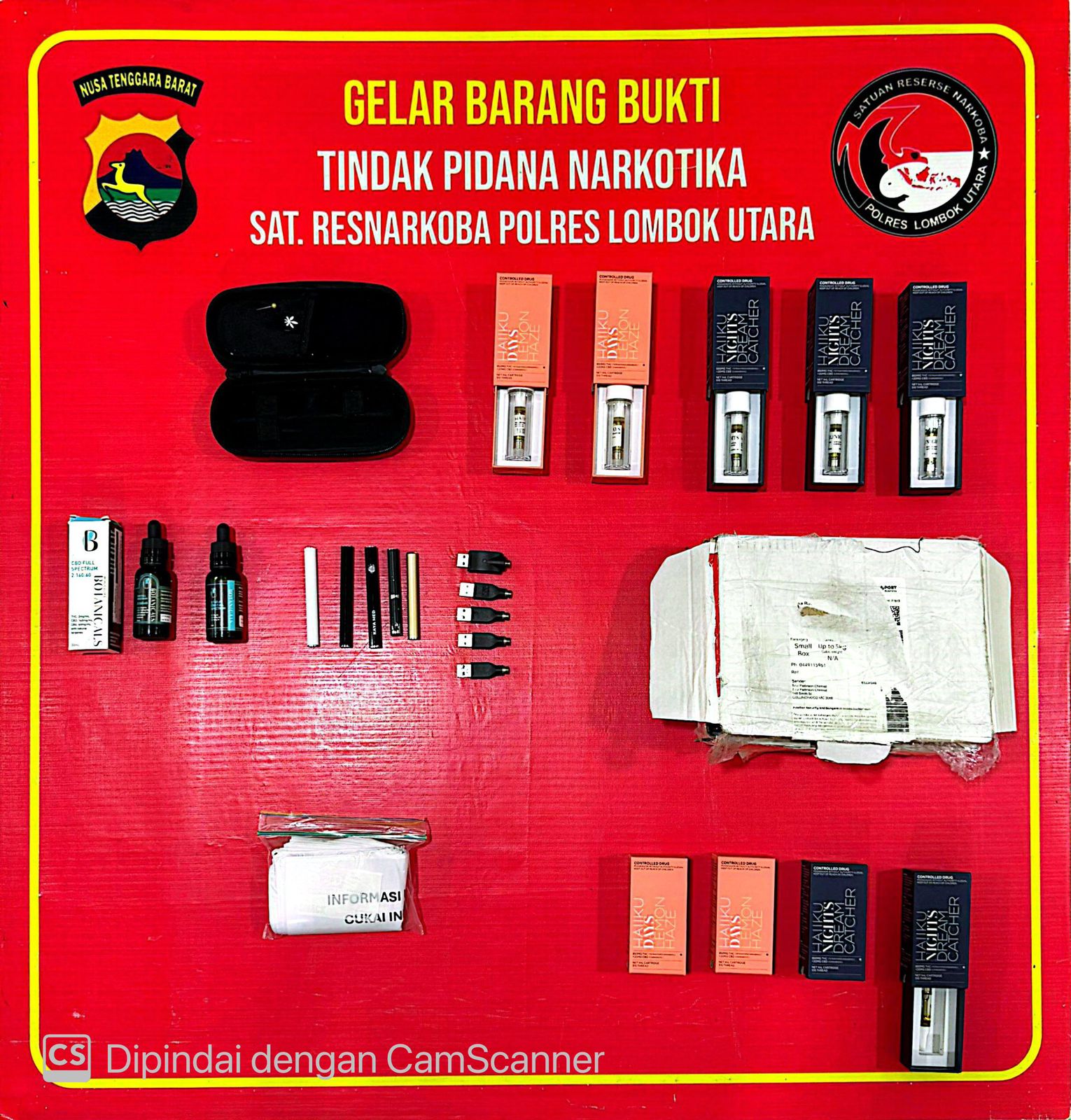 More than a dozen vape items laid out on a table.