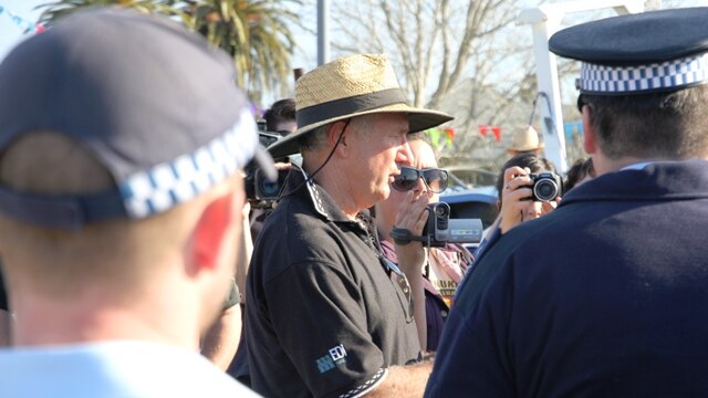 Police today issuing an infringement notice to Fullerton Cove Action Group spokesman, Lindsay Clout.