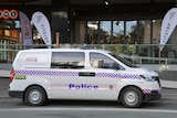 A police van parked on the street in the Brisbane suburn of Milton.