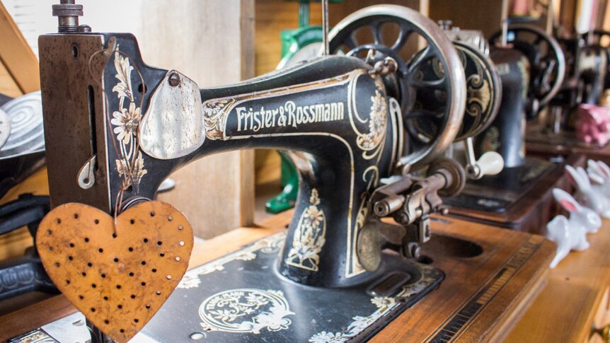 A collection of sewing machines from the 19th century.