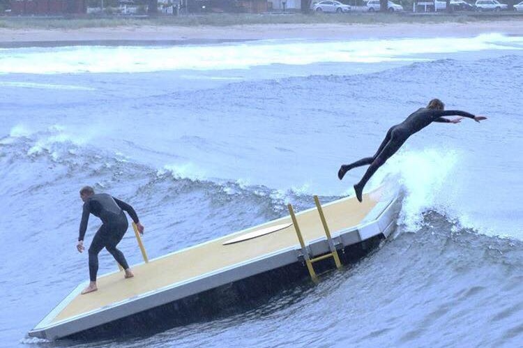 A pontoon which broke its moorings at Kingston Beach is used by swimmers, December 3, 2017.