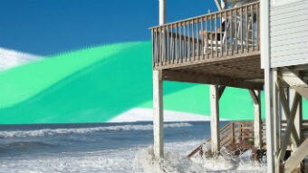 Waves crash underneath a beach-front house. for a story on the effects on climate change on properties