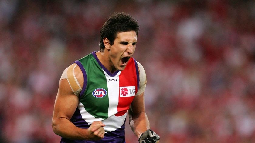 Matthew Pavlich clenches his fist in celebration (action pic)