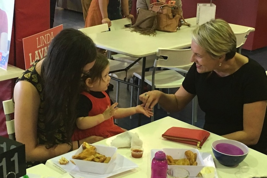 Deputy Labor leader Tanya Plibersek greets child on election campaign trail in Strathpine