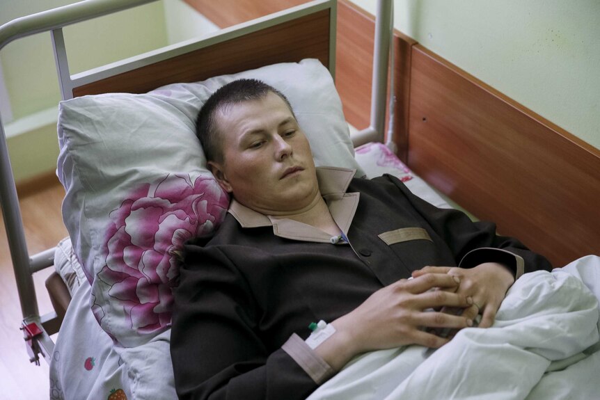 A man purported to be a Russian soldier in a Kiev hospital