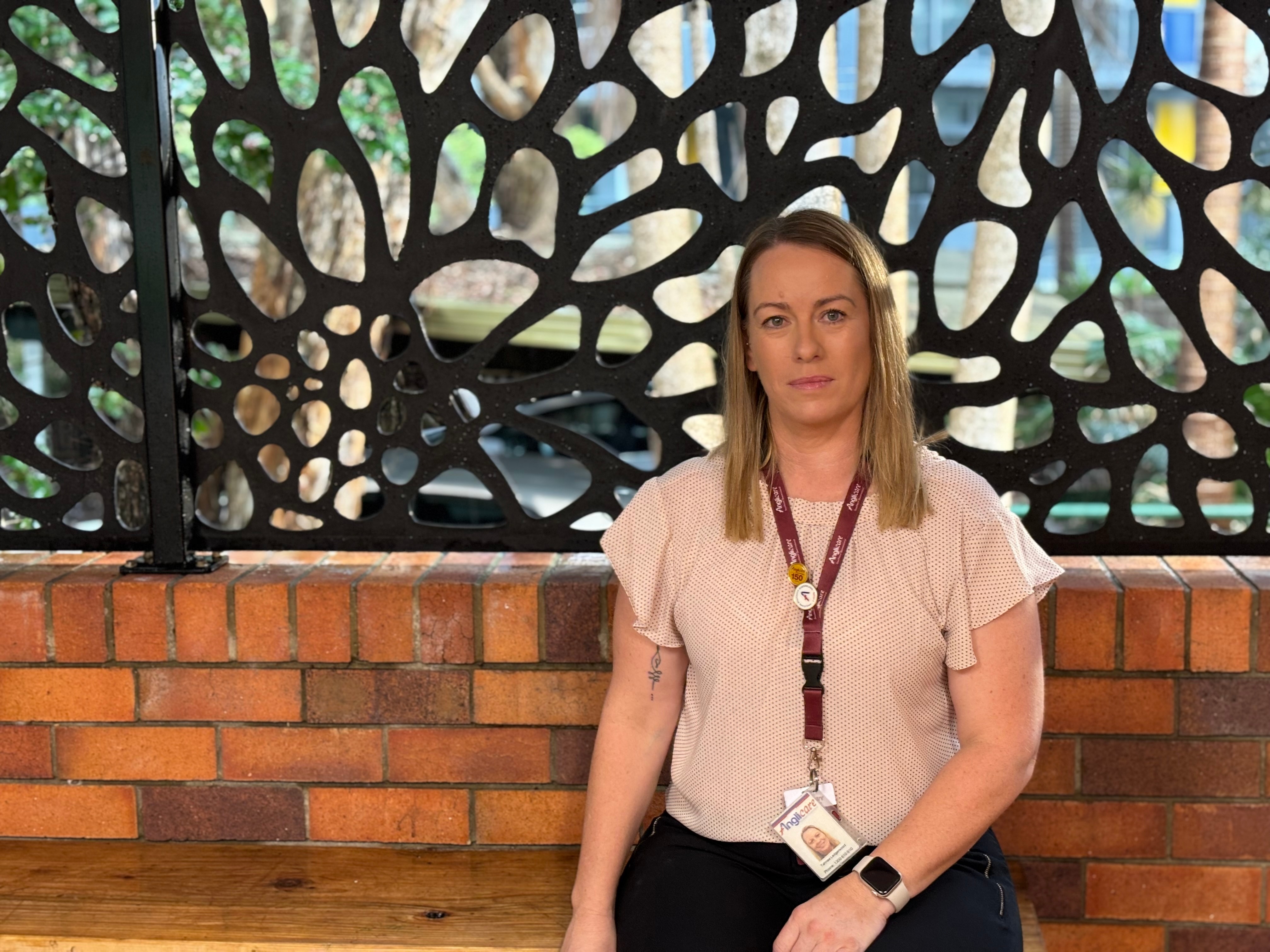 A woman sits on a bench