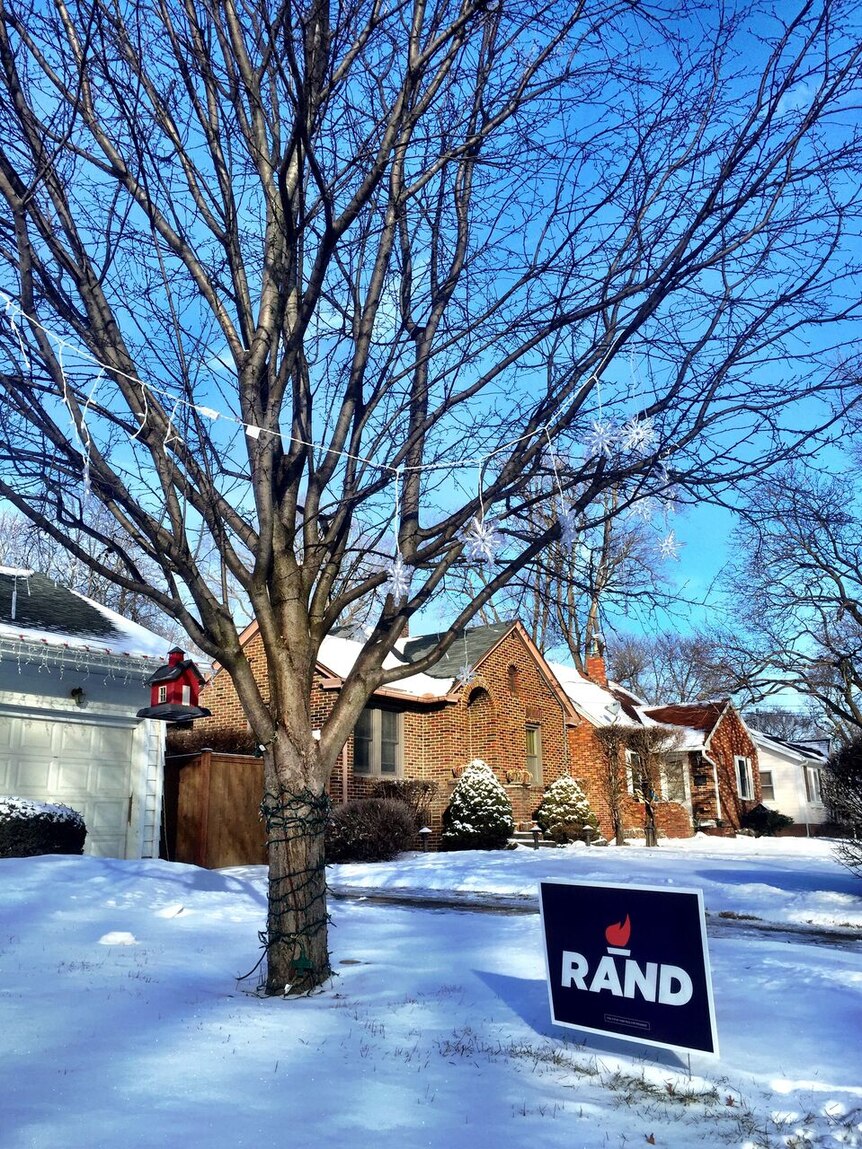 A sign supporting Rand Paul outside a snow-covered home in Iowa.