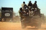 Malian soldiers transport suspected Islamist rebels on after arresting them north of Gao