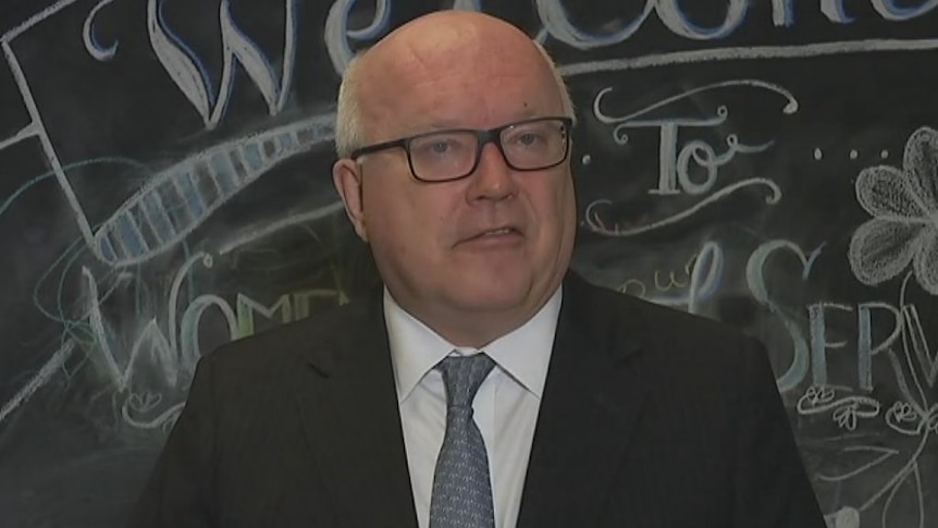 George Brandis gives a press conference