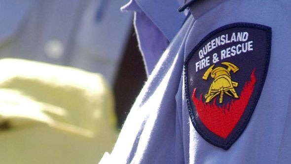 A Queensland Fire and Rescue officer attends the scene of an incident