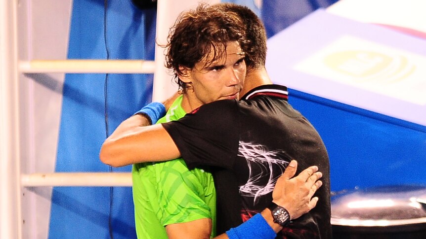 Nadal and Djokovic embrace after their thrilling final