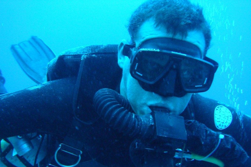 A diver photographed underwater.
