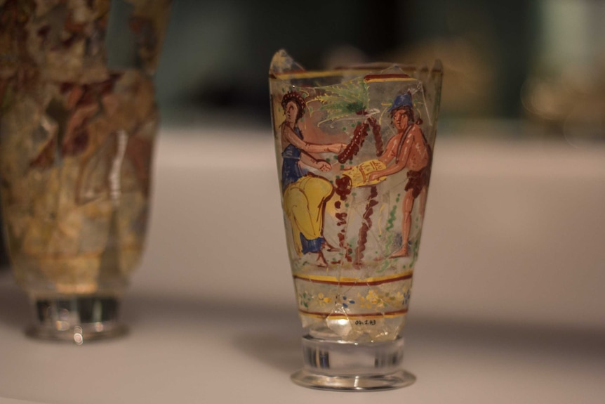 Enamelled glass goblet with figures harvesting dates.