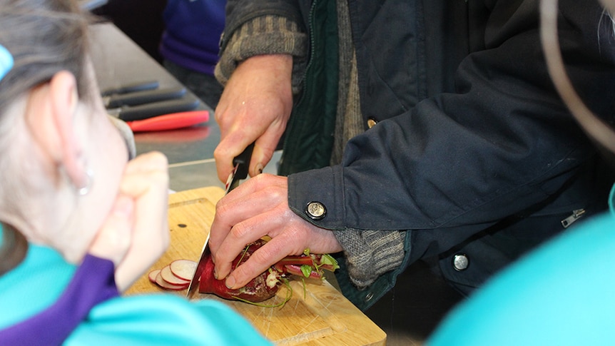 Vegetable preparation being shown to students