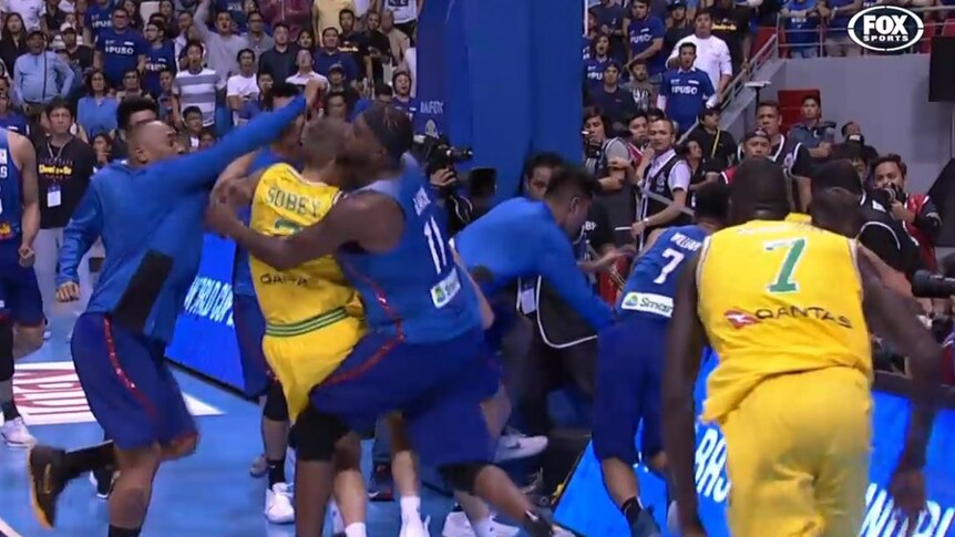 Players from the Philippines and Australia fight.