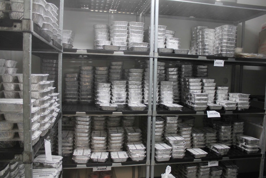 A cool room freezer full of individually packaged meals