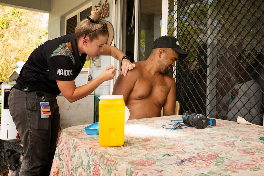 A man gets a COVID-19 vaccination.