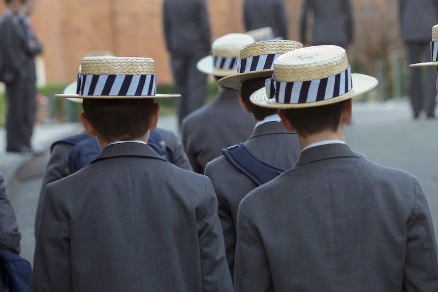 Backs of school students in uniform