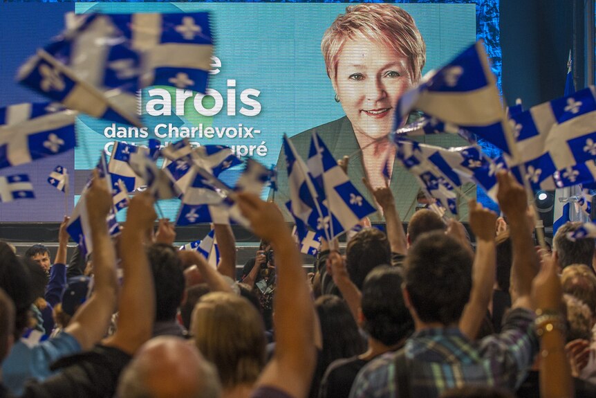 Supporters of Pauline Marois cheer election results
