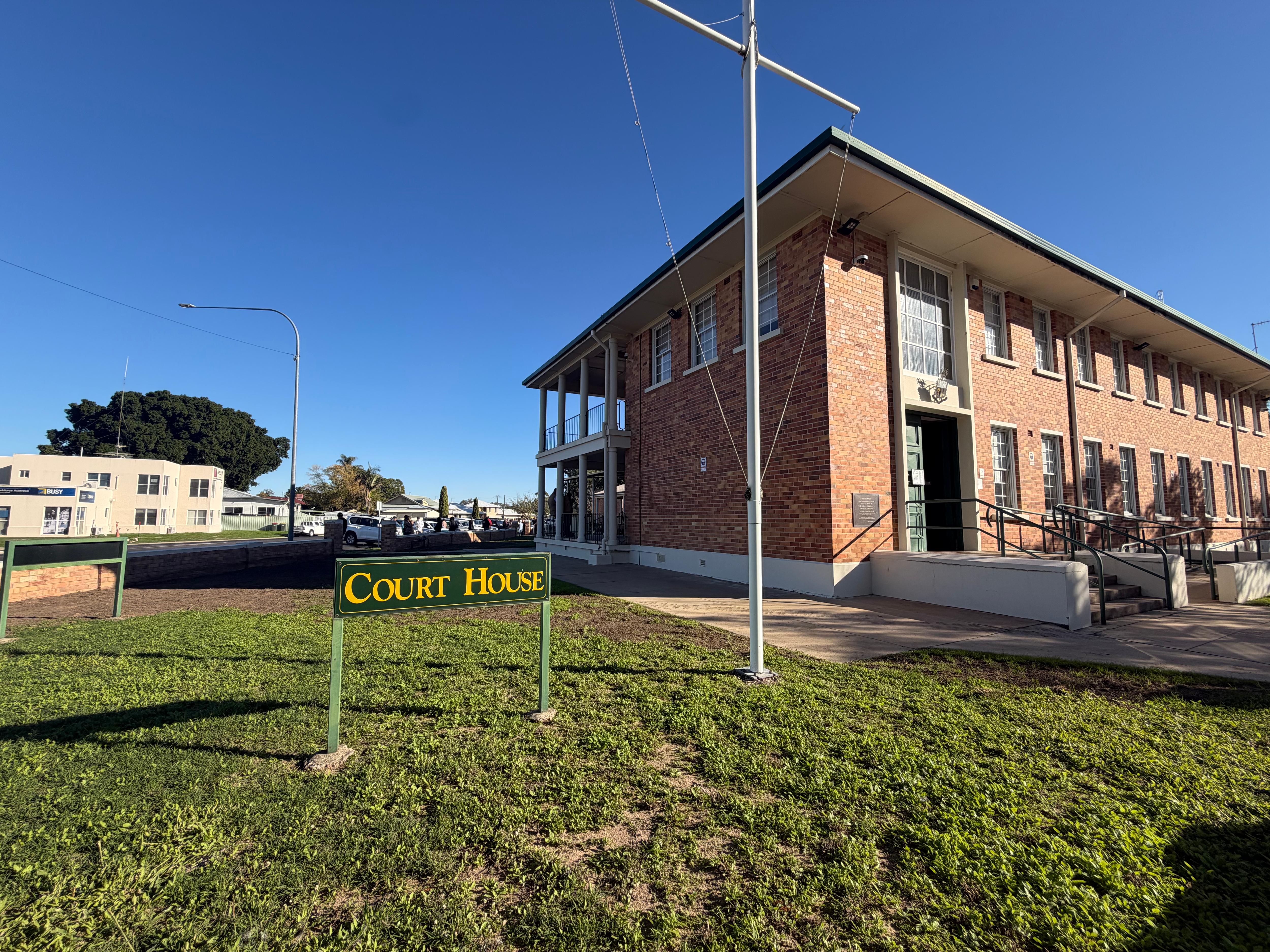 An old brick court building in Goondiwindi on a clear day. 