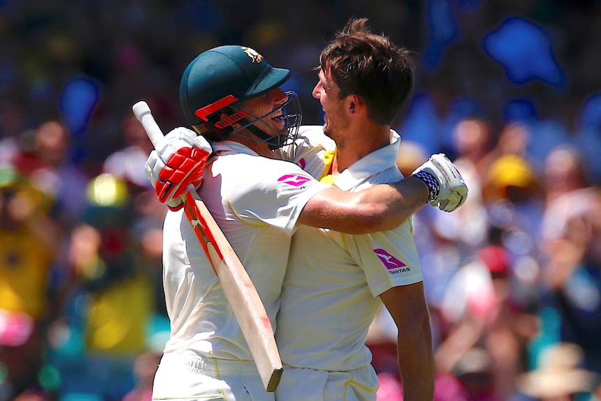 Australia's Mitchell Marsh is hugged by his brother and team mate Shaun Marsh after reaching an Ashes century.