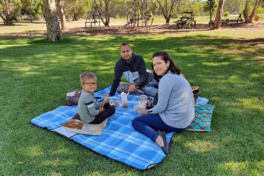 Bundaberg mum Amber-Lee Lederhose with her family having a picnic,