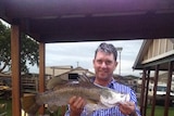 Man holding a fish